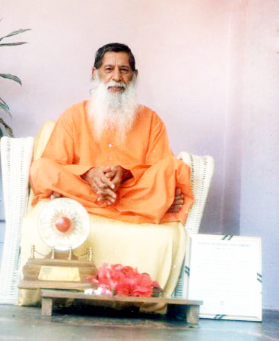 Shri Kumarswamiji seated with an award